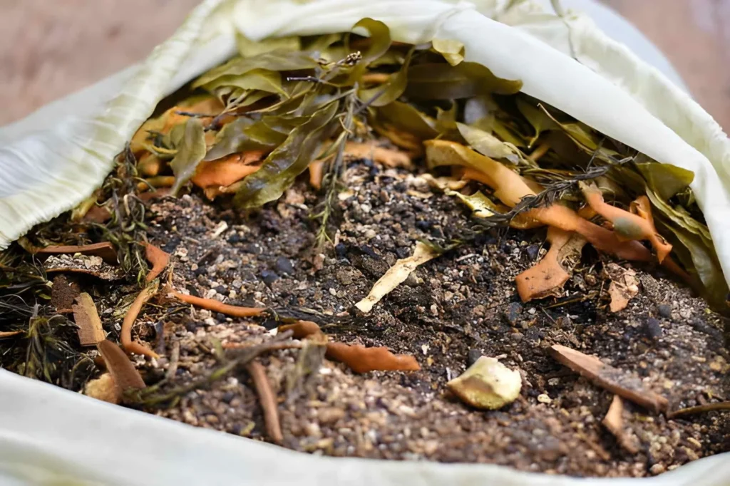 Bag of dried seaweed and kelp meal, showing one of the plant-based organic fertilizer types used to enrich garden soil.