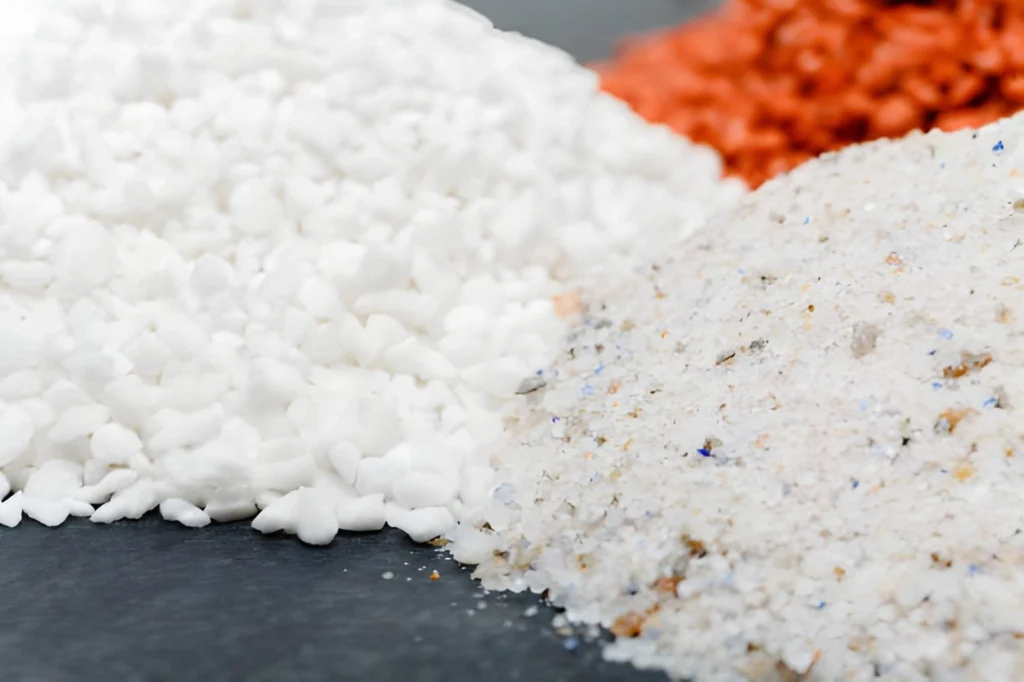 Close-up of powdered and granular mineral amendments representing different organic fertilizer types used to supply nutrients to garden soil.