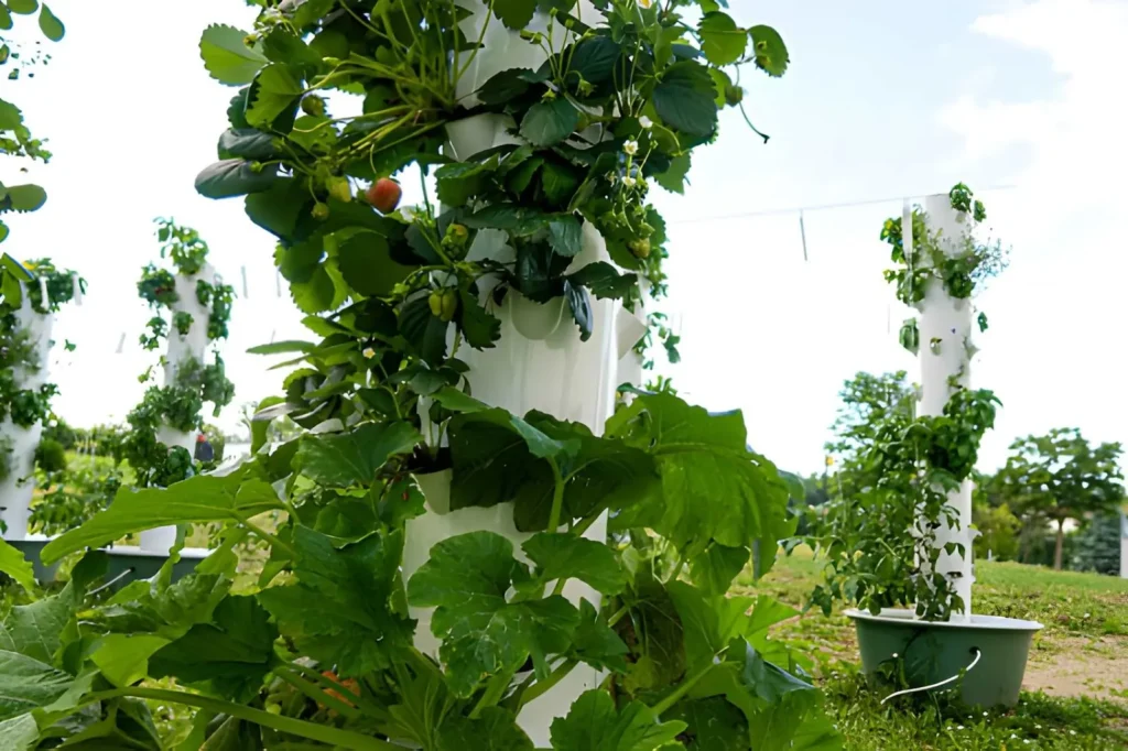 Vertical tower garden growing strawberries and leafy vegetables, illustrating space-saving garden types for small yards and urban gardens.