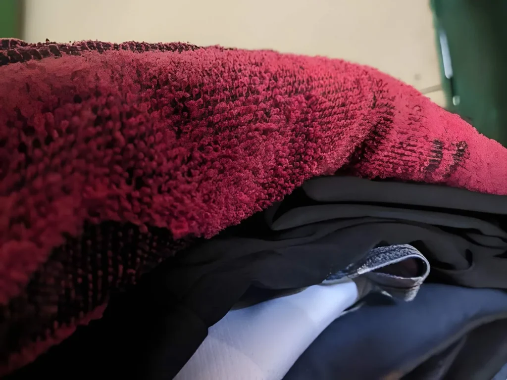 Warm blanket and layered clothing packed for a homestead emergency kit during a severe storm or extended power outage.